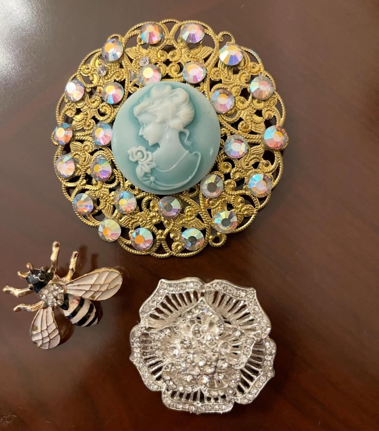 Three vintage brooches